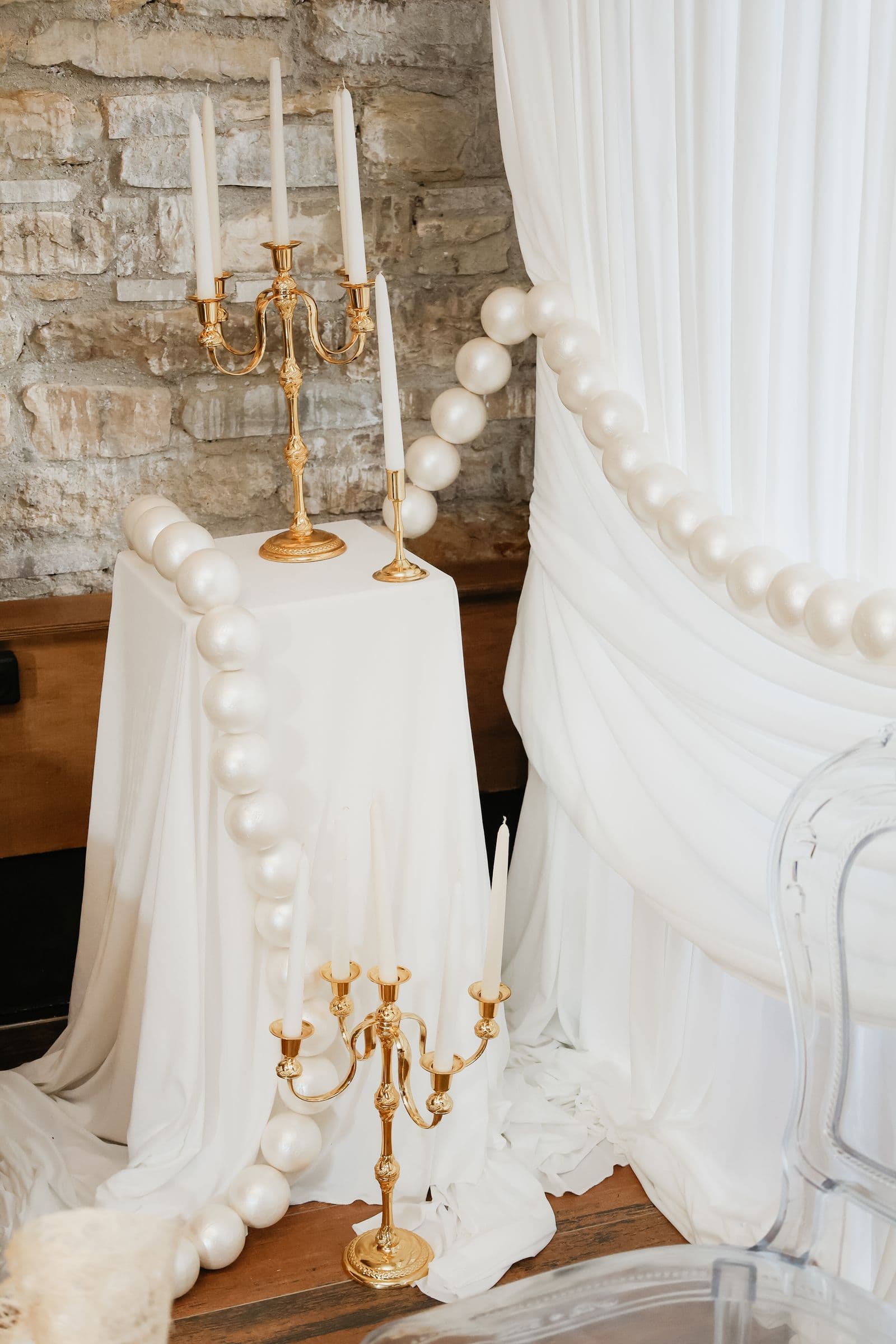 Elegant wedding draping with white drapes and candlelit event decor